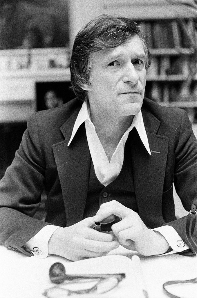 Hugh Hefner sits at desk - Chicago Sun-Times