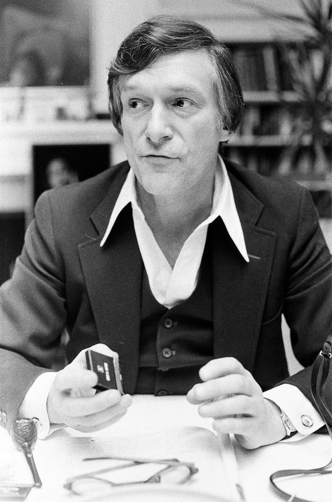 Hugh Hefner sits at desk - Chicago Sun-Times