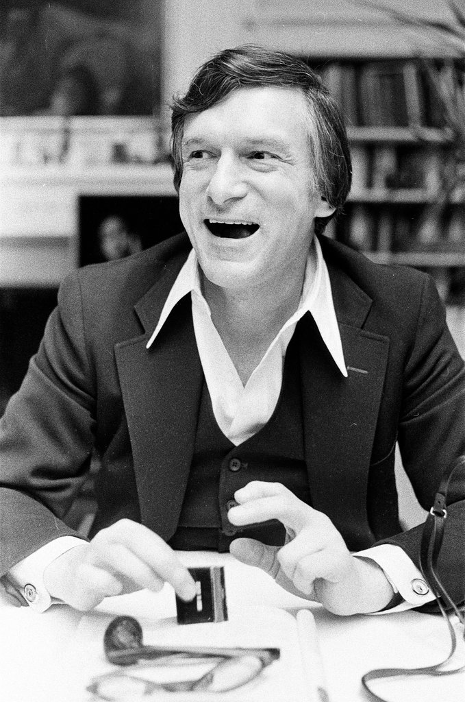 Hugh Hefner sits at desk - Chicago Sun-Times