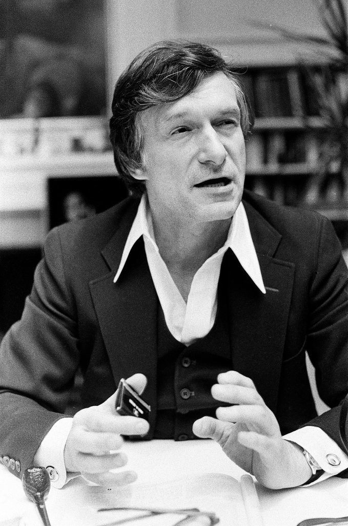 Hugh Hefner sits at desk - Chicago Sun-Times