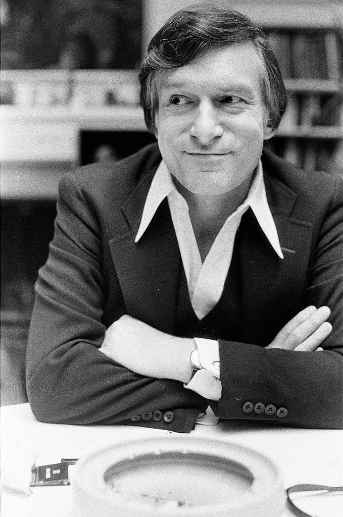Hugh Hefner sits at desk - Chicago Sun-Times