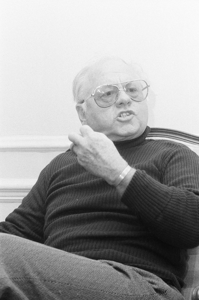Mickey Rooney sitting in a chair - Jerry Tomaselli for Chicago Sun-Times