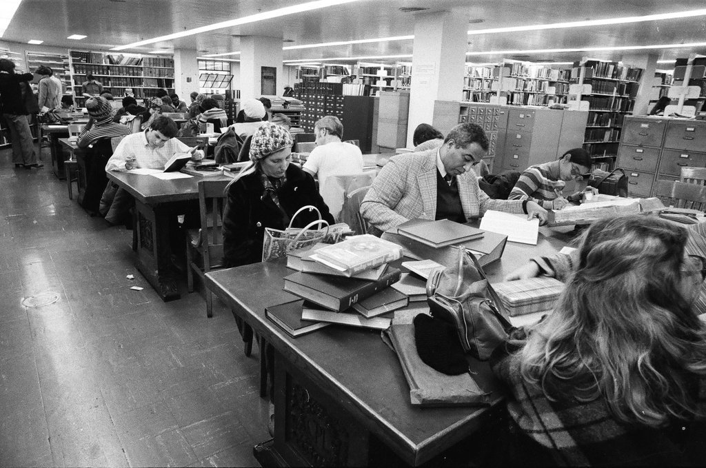 Library patrons work at desks and in the stacks - Chicago Sun-Times