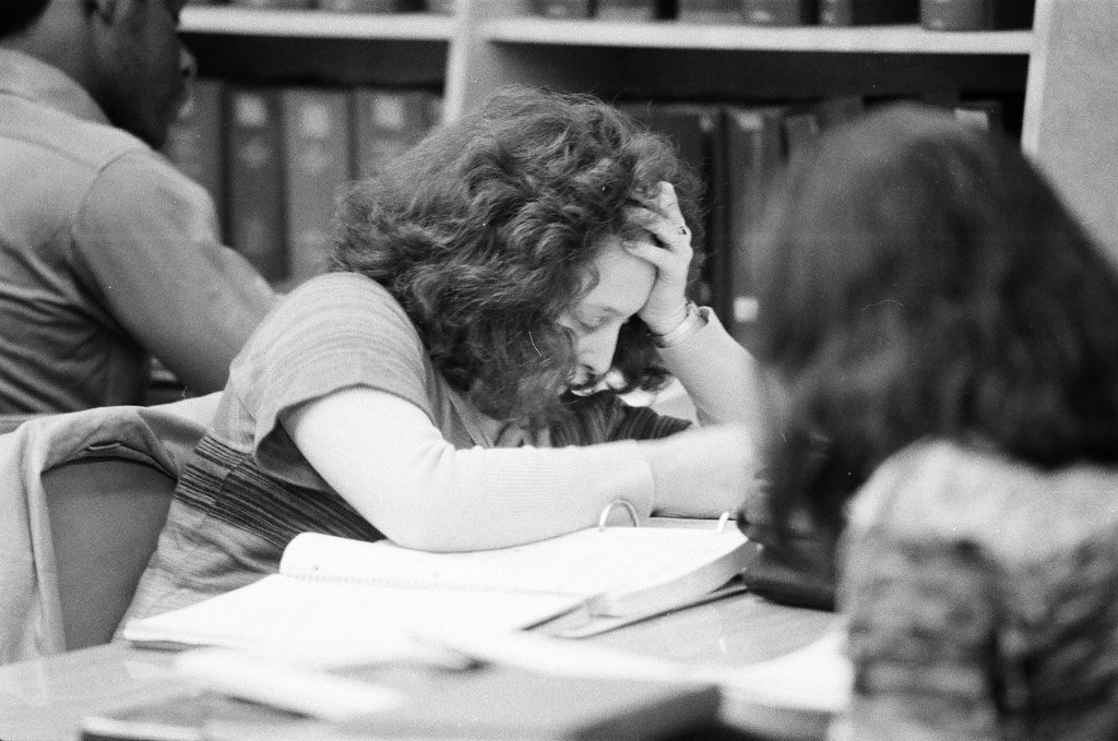 Library patrons work at desks and in the stacks - Chicago Sun-Times