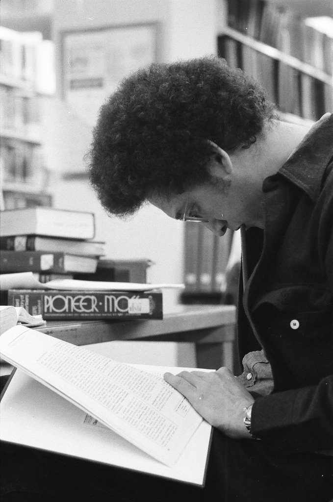 Library patrons work at desks and in the stacks - Chicago Sun-Times