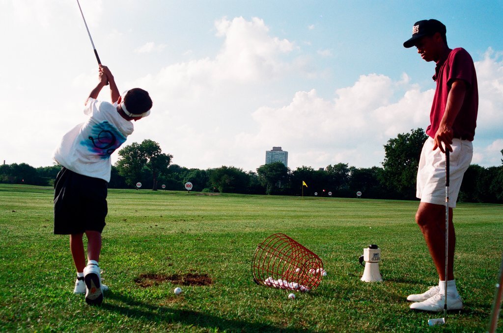 Tiger Woods hitting golf balls - Chicago Sun-Times