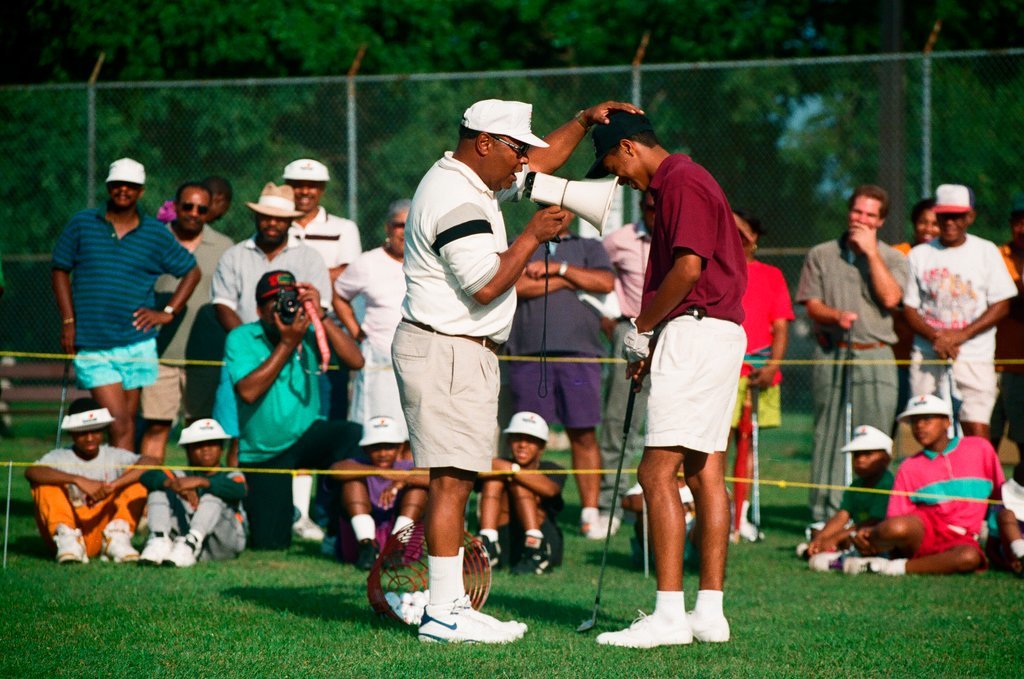 Tiger Woods hitting golf balls - Chicago Sun-Times