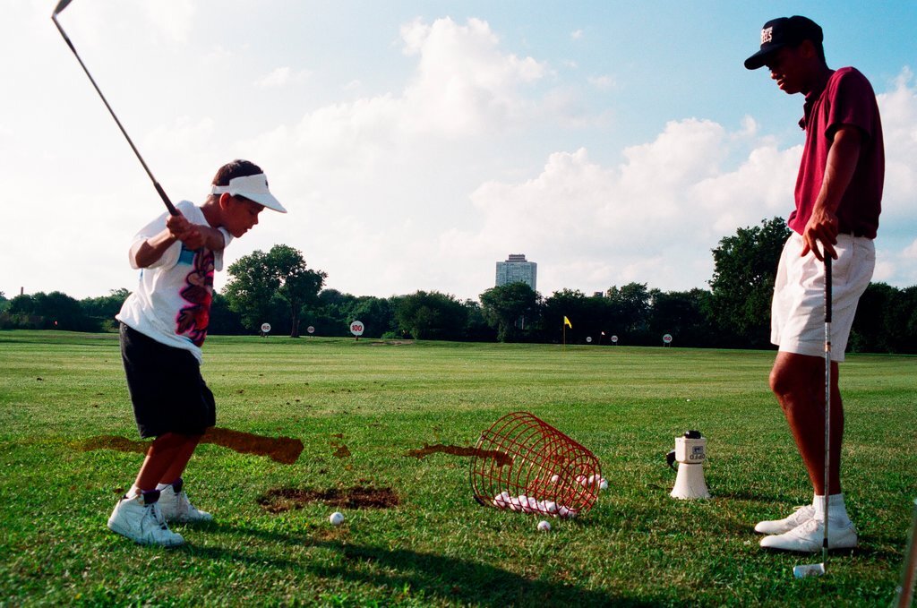 Tiger Woods hitting golf balls - Chicago Sun-Times