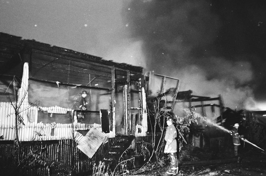Firefighters wield hoses at the scene of a fire - Chicago Sun-Times