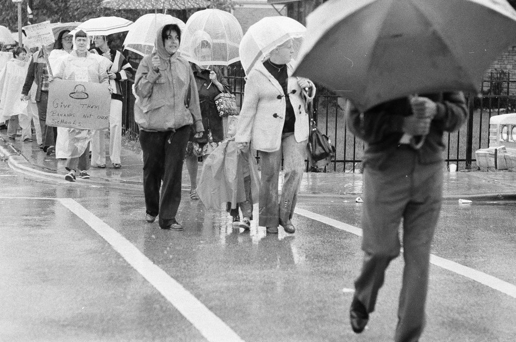 Anti-busing picketers march in the pouring rain - Gene Pesek for Chicago Sun-Times