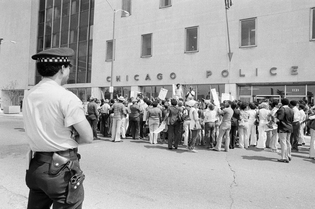 People protest racist behavior outside police headquarters - Jim Frost for Chicago Sun-Times