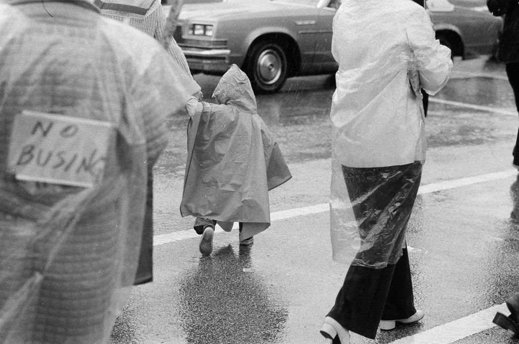 Anti-busing picketers march in the pouring rain - Gene Pesek for Chicago Sun-Times