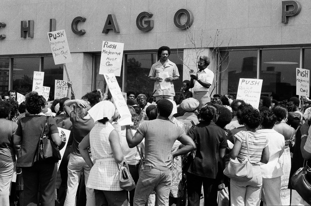 People protest racist behavior outside police headquarters - Jim Frost for Chicago Sun-Times