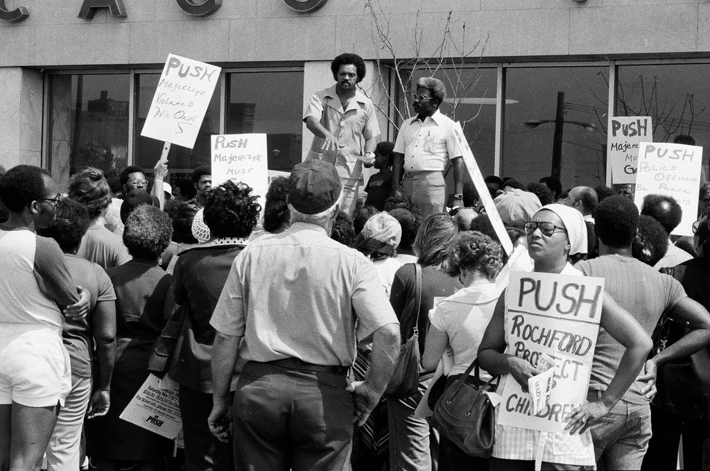 People protest racist behavior outside police headquarters - Jim Frost for Chicago Sun-Times