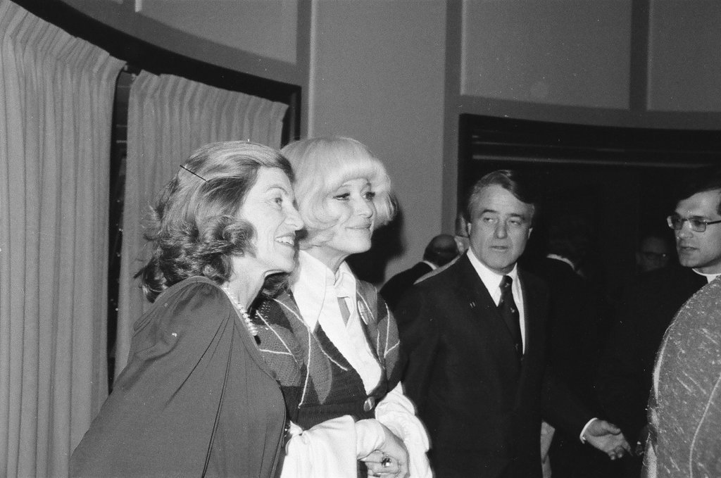 Sargent R. Shriver and his wife at a cocktail party - Henry Herr Gill for Chicago Sun-Times