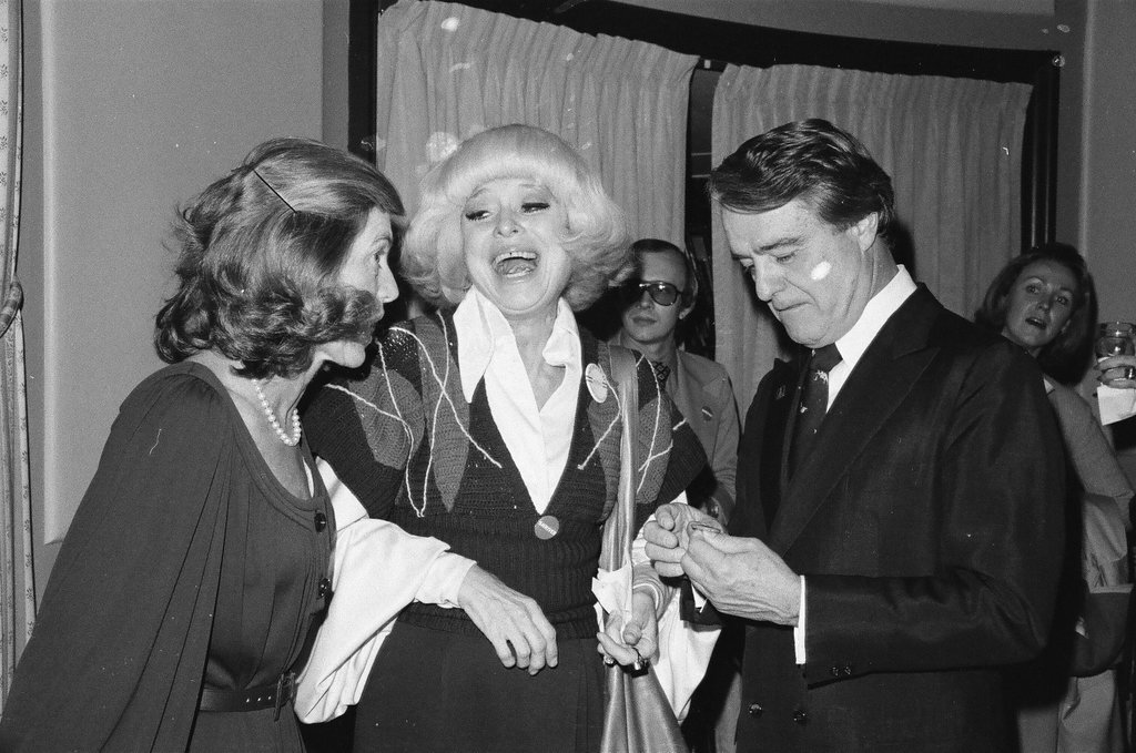 Sargent R. Shriver and his wife at a cocktail party - Henry Herr Gill for Chicago Sun-Times