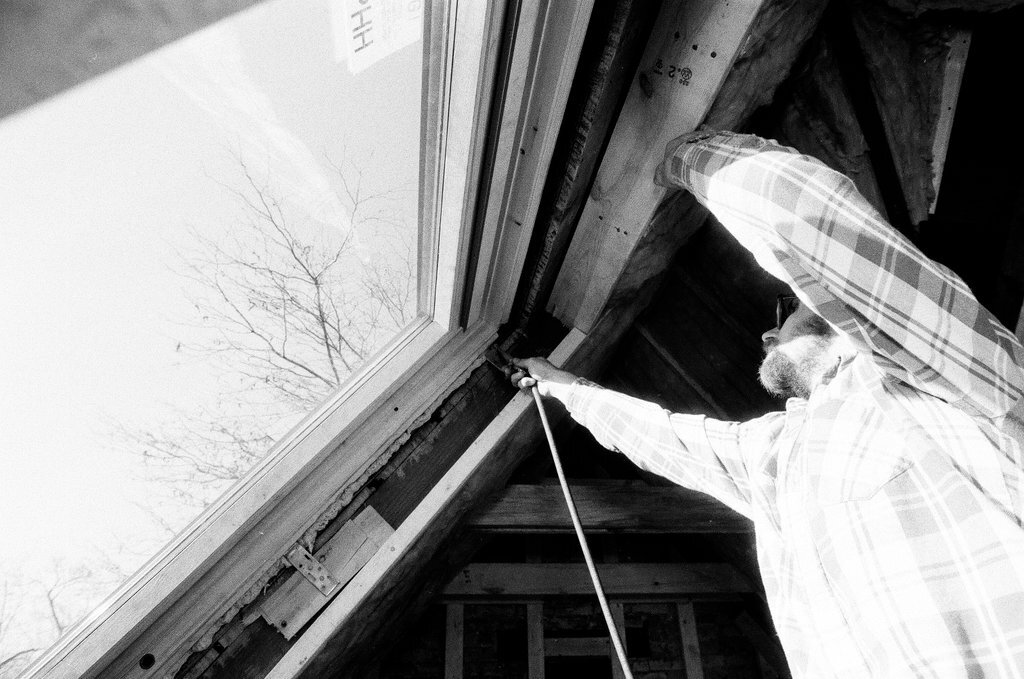 Workers install insulation in a house - Gene Pesek for Chicago Sun-Times
