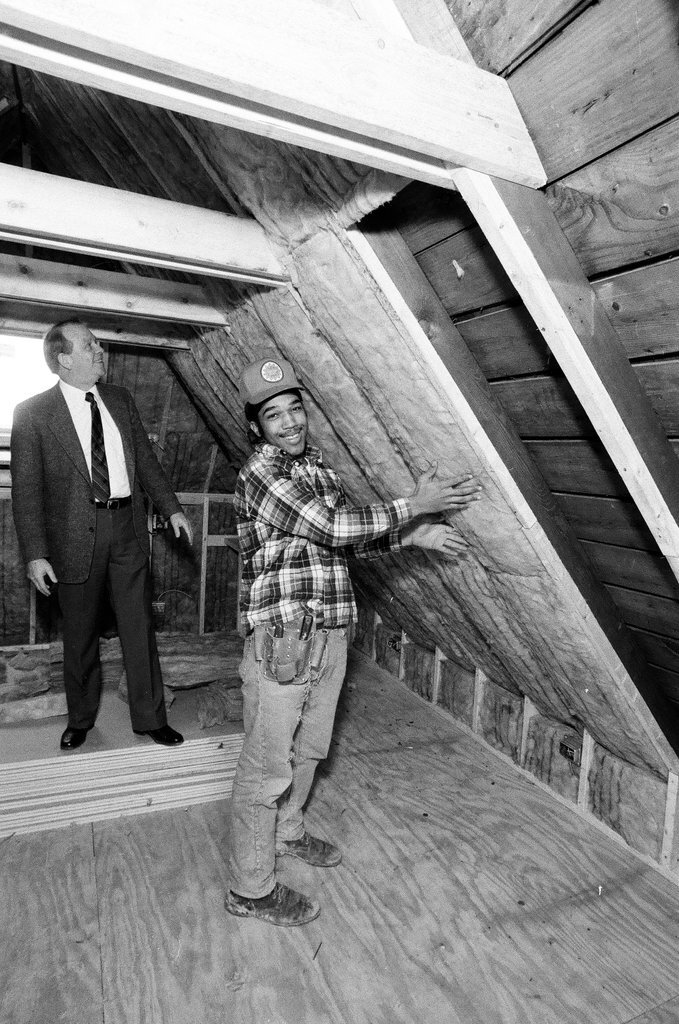 Workers install insulation in a house - Gene Pesek for Chicago Sun-Times