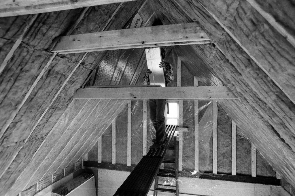 Workers install insulation in a house - Gene Pesek for Chicago Sun-Times