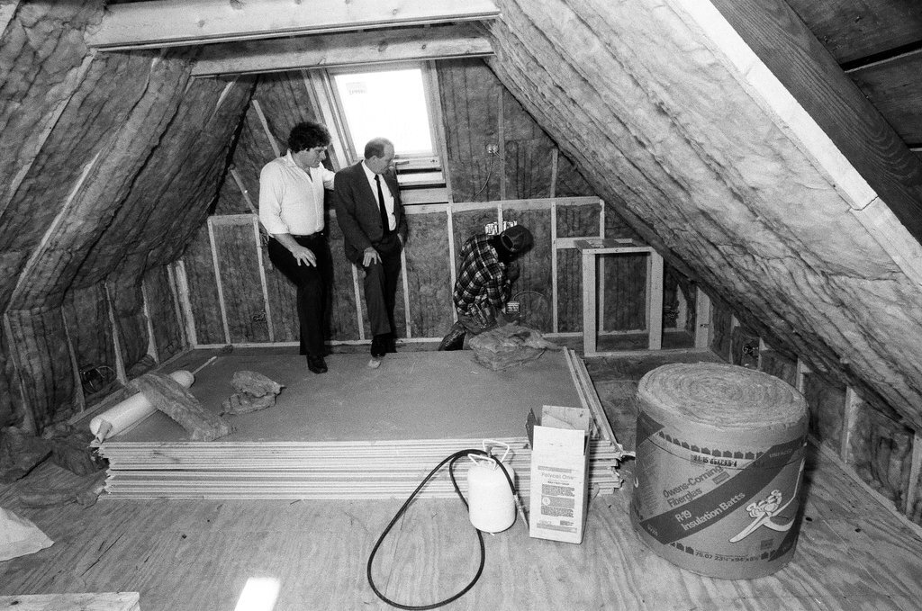 Workers install insulation in a house - Gene Pesek for Chicago Sun-Times
