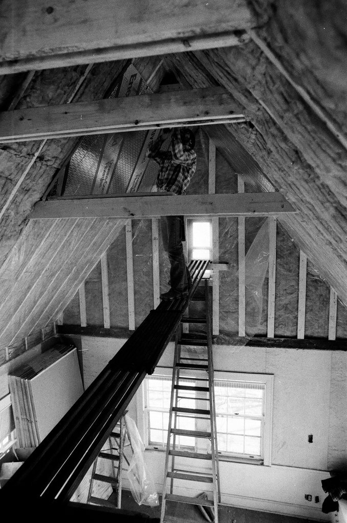 Workers install insulation in a house - Gene Pesek for Chicago Sun-Times
