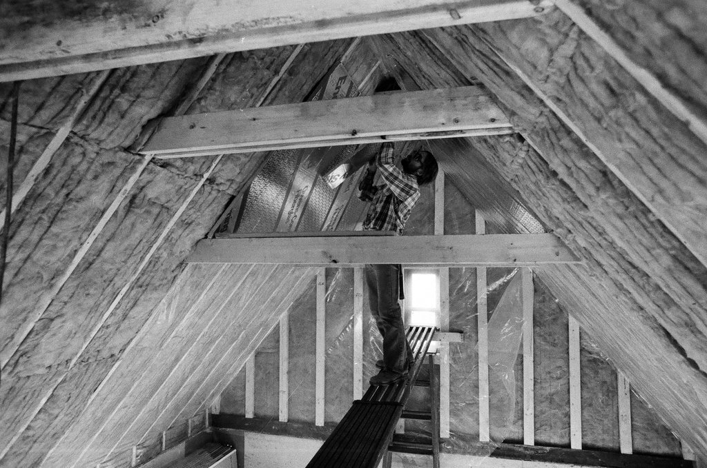 Workers install insulation in a house - Gene Pesek for Chicago Sun-Times