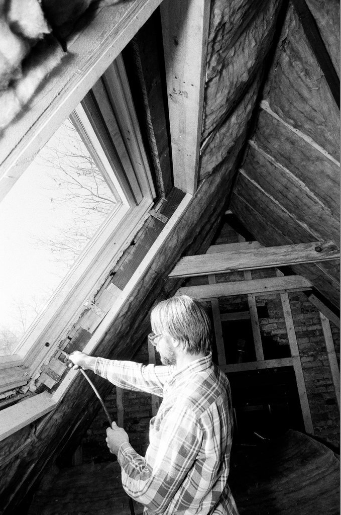 Workers install insulation in a house - Gene Pesek for Chicago Sun-Times