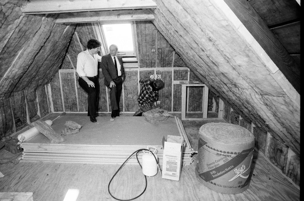 Workers install insulation in a house - Gene Pesek for Chicago Sun-Times