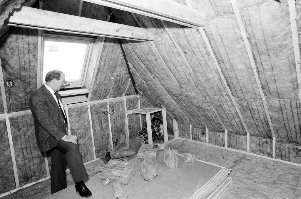 Workers install insulation in a house - Gene Pesek for Chicago Sun-Times