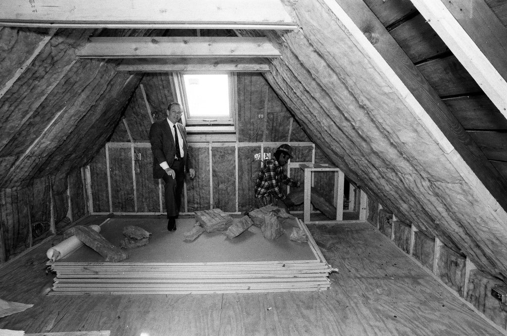 Workers install insulation in a house - Gene Pesek for Chicago Sun-Times
