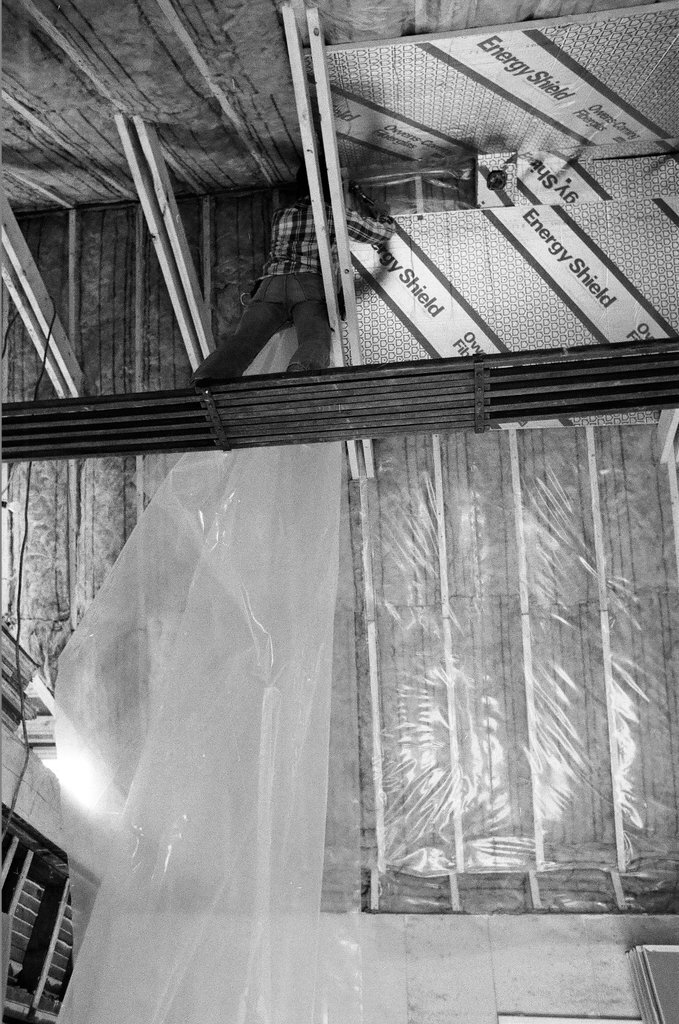 Workers install insulation in a house - Gene Pesek for Chicago Sun-Times
