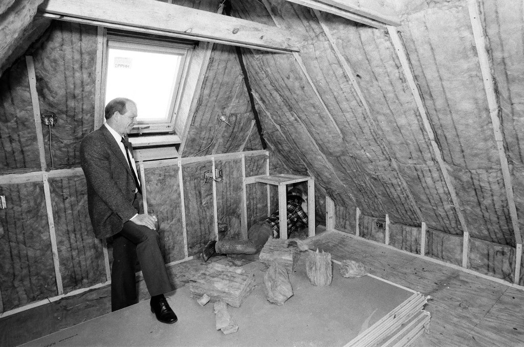 Workers install insulation in a house - Gene Pesek for Chicago Sun-Times