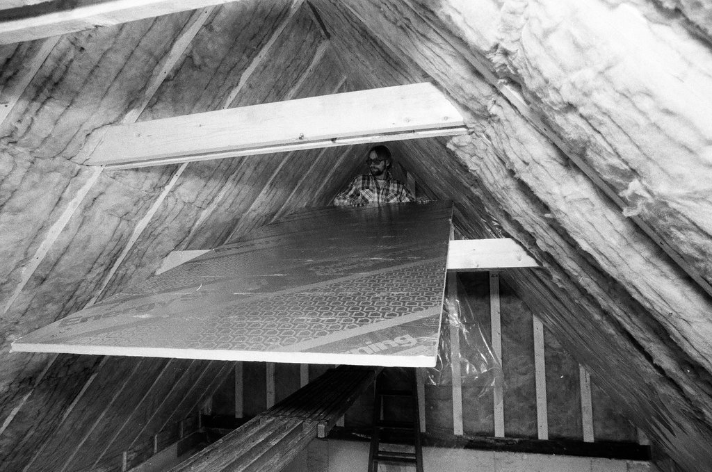 Workers install insulation in a house - Gene Pesek for Chicago Sun-Times