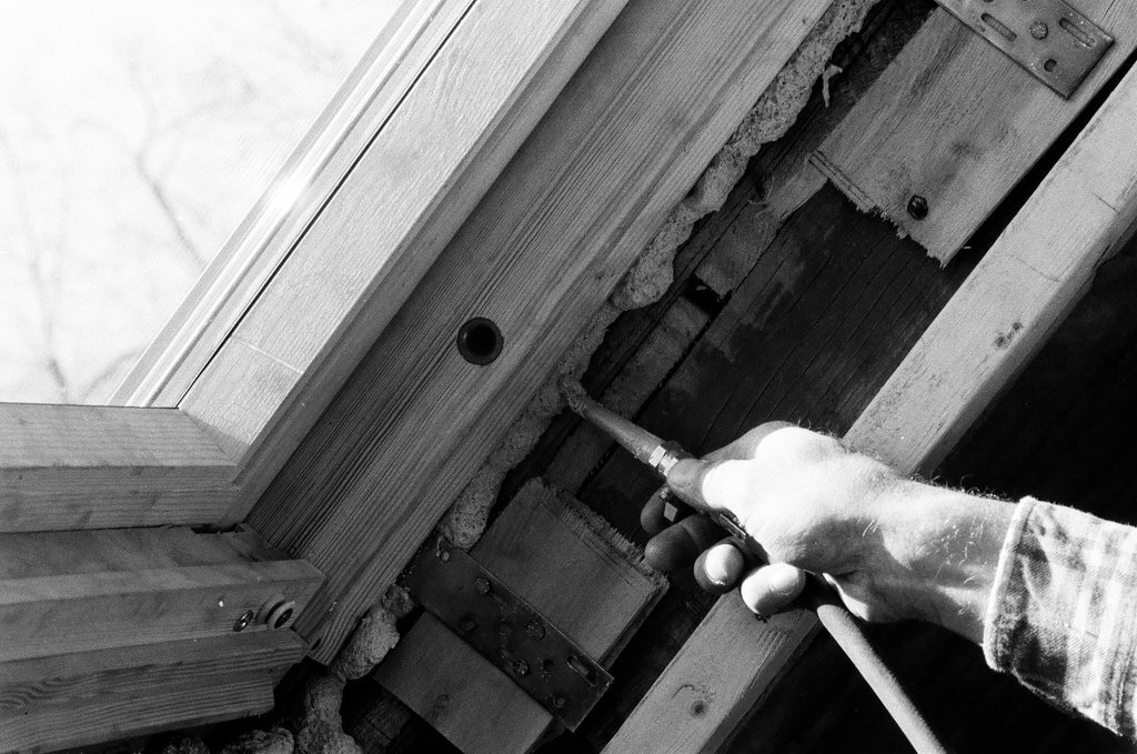 Workers install insulation in a house - Gene Pesek for Chicago Sun-Times
