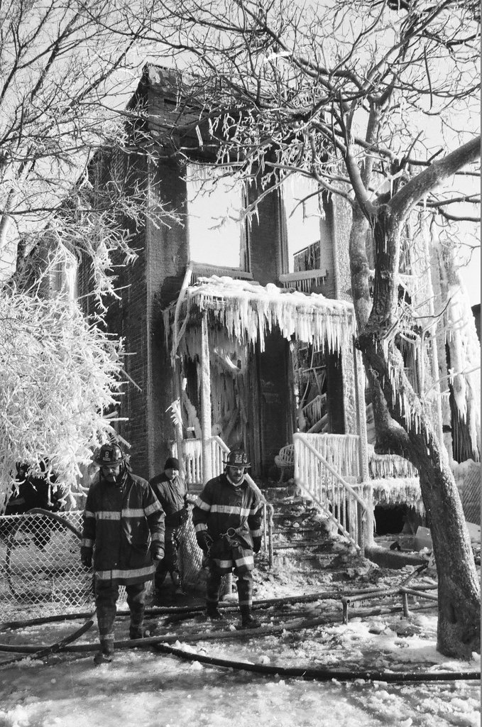 Firemen retrieve bodies from house fire - Al Podgorski for Chicago Sun-Times
