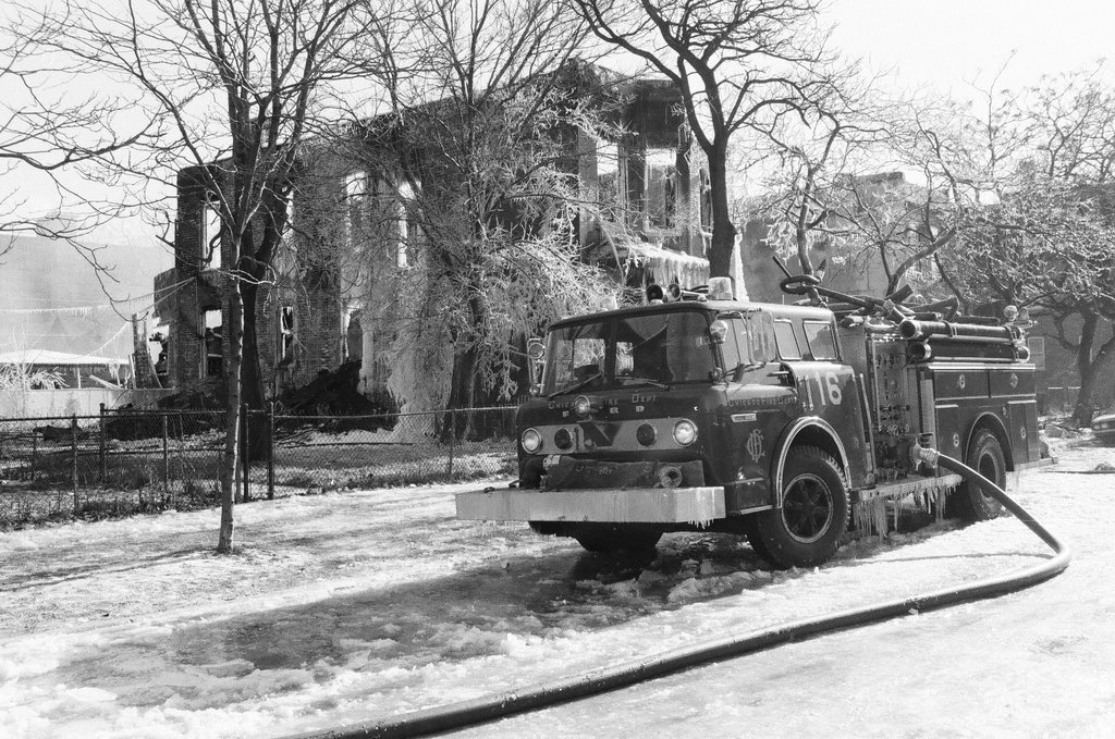 Firemen retrieve bodies from house fire - Al Podgorski for Chicago Sun-Times