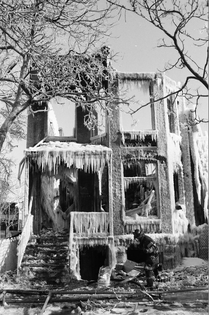 Firemen retrieve bodies from house fire - Al Podgorski for Chicago Sun-Times
