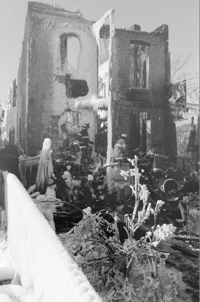 Firemen retrieve bodies from house fire - Al Podgorski for Chicago Sun-Times
