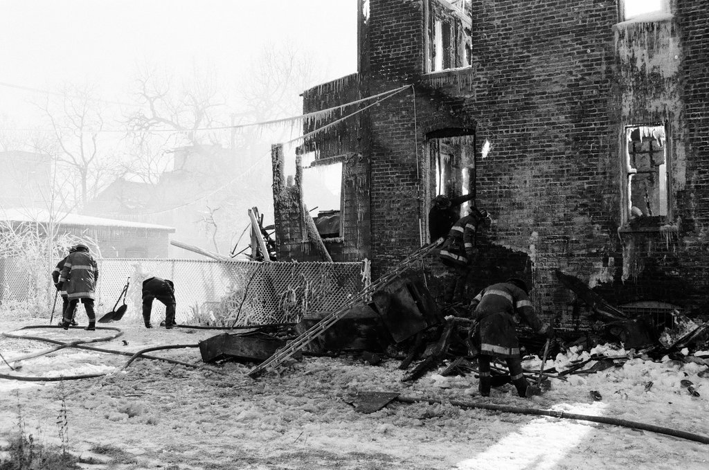 Firemen retrieve bodies from house fire - Al Podgorski for Chicago Sun-Times