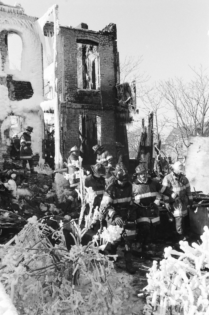 Firemen retrieve bodies from house fire - Al Podgorski for Chicago Sun-Times