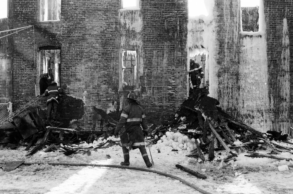 Firemen retrieve bodies from house fire - Al Podgorski for Chicago Sun-Times