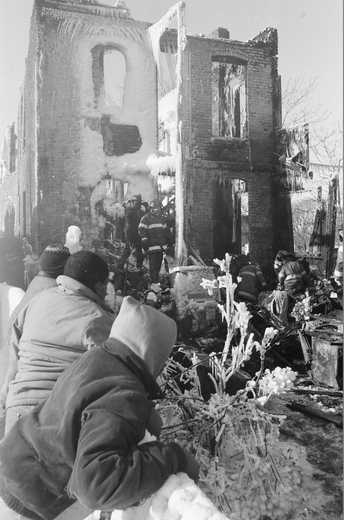 Firemen retrieve bodies from house fire - Al Podgorski for Chicago Sun-Times