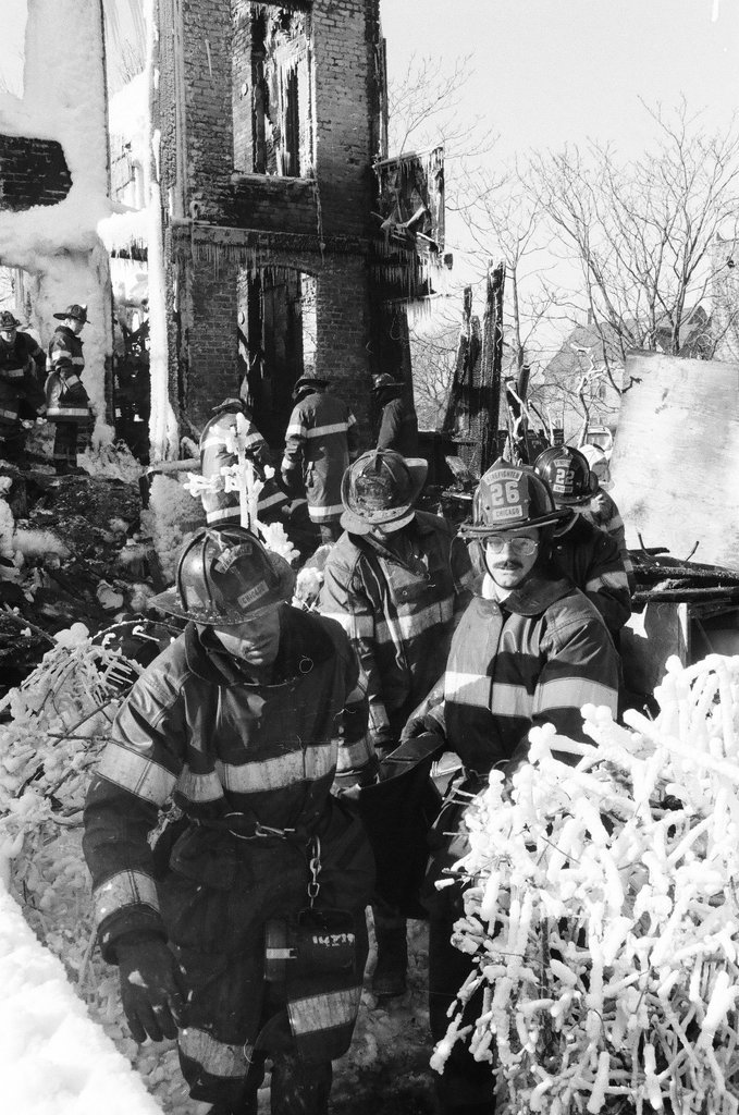 Firemen retrieve bodies from house fire - Al Podgorski for Chicago Sun-Times