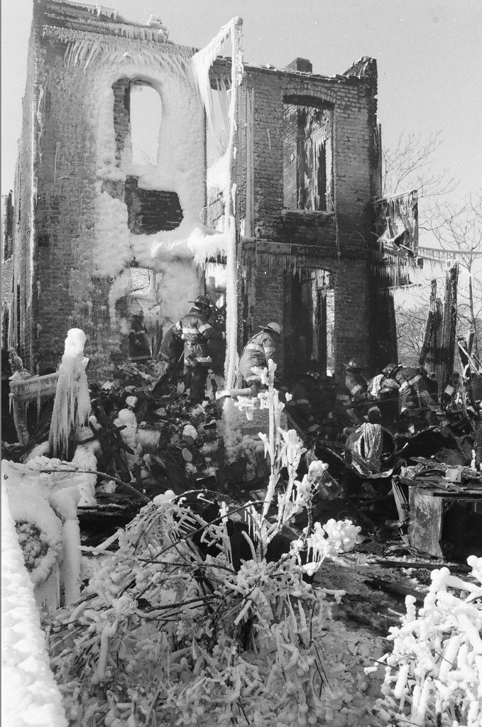 Firemen retrieve bodies from house fire - Al Podgorski for Chicago Sun-Times