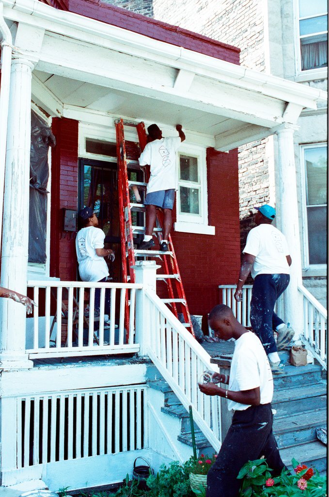 Teens from Look to the Future program paint a porch - Jon Sall for Chicago Sun-Times