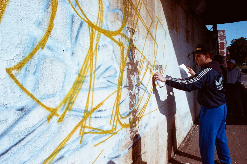 Graffiti artists paint a viaduct - Ellen Domke for Chicago Sun-Times