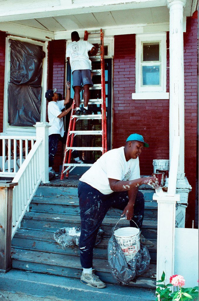 Teens from Look to the Future program paint a porch - Jon Sall for Chicago Sun-Times