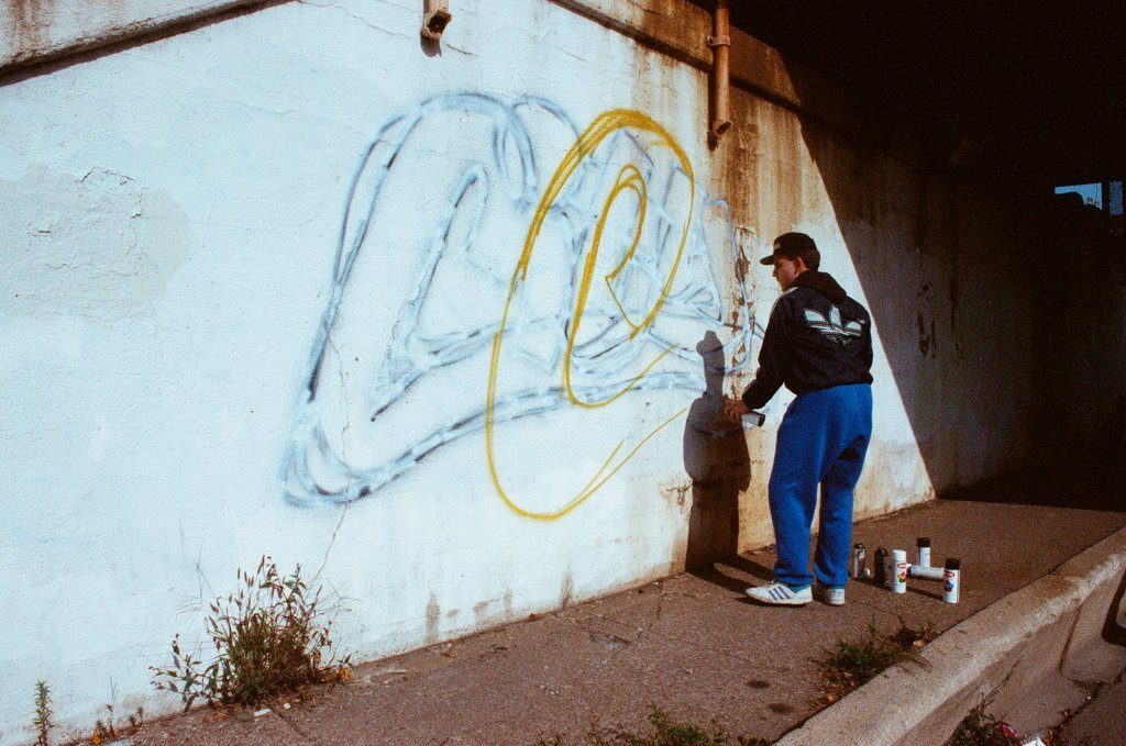 Graffiti artists paint a viaduct - Ellen Domke for Chicago Sun-Times