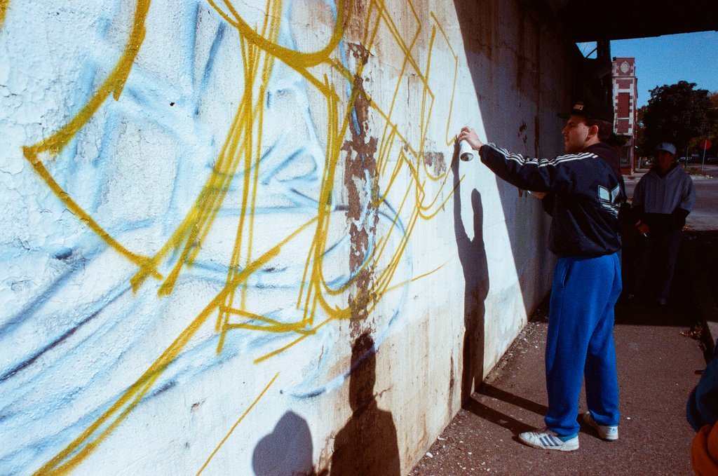 Graffiti artists paint a viaduct - Ellen Domke for Chicago Sun-Times