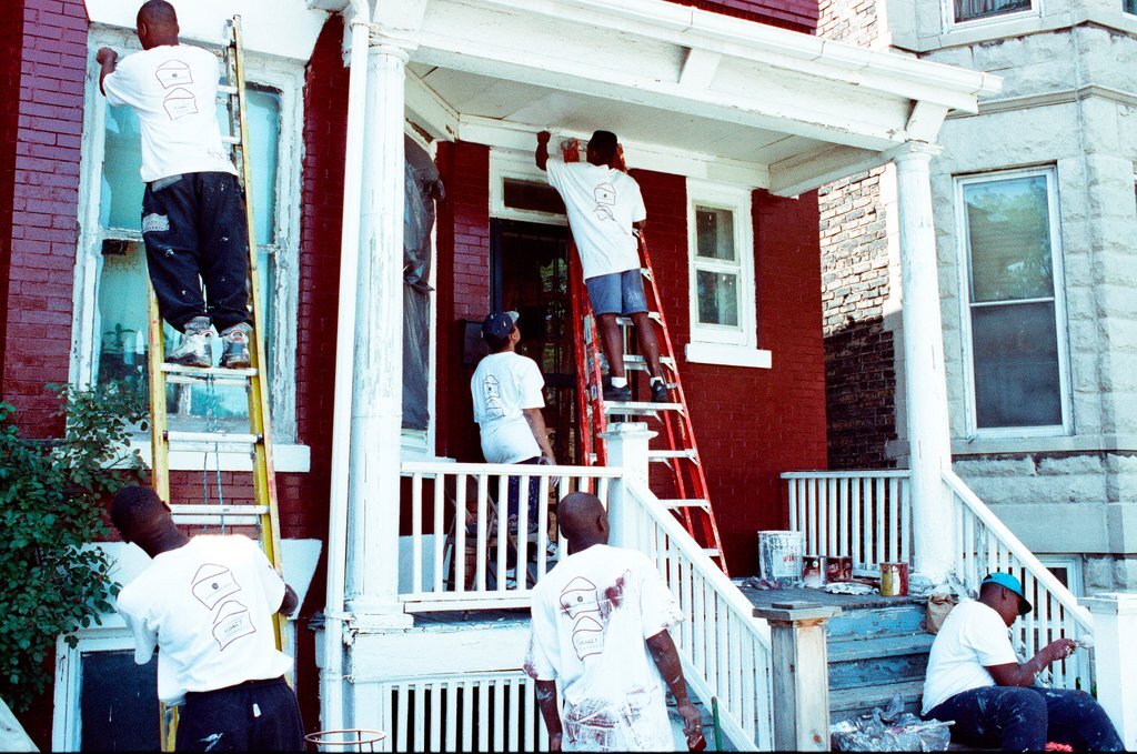 Teens from Look to the Future program paint a porch - Jon Sall for Chicago Sun-Times
